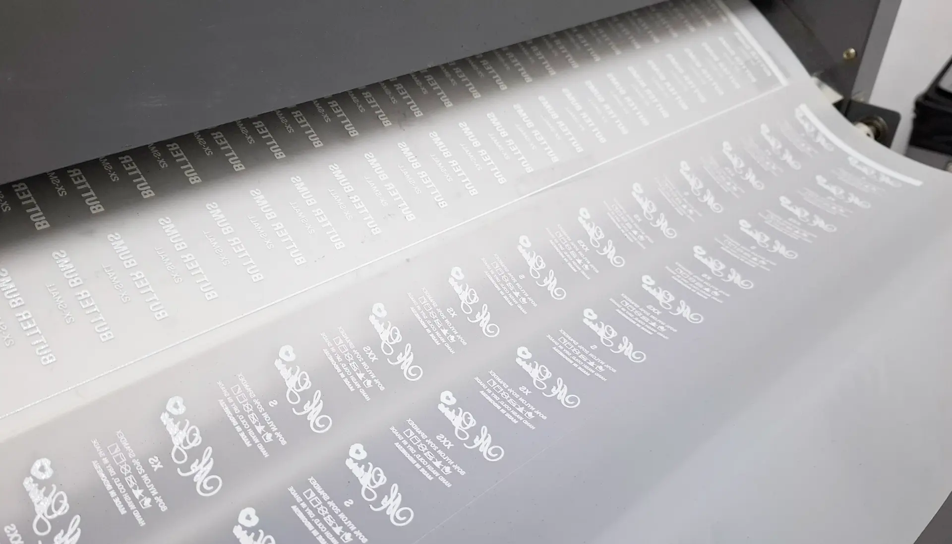 Heat-transfer label sheets printed for swimwear branding